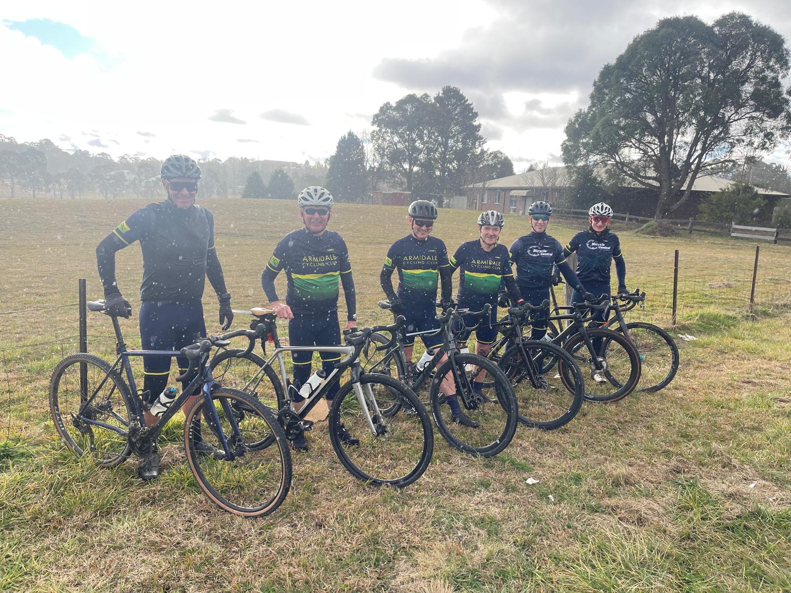 Riders in the rain after a gravel cycling race